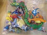a lot of small plastic toys in a plastic bag
