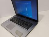 a laptop that is sitting on a white table