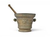 mortar with a wooden stick in it on a white background
