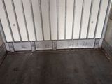 a metal gate in the middle of a room