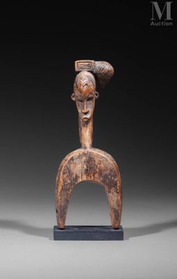 an image of a wooden sculpture of a woman ' s head