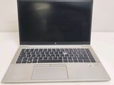 an open laptop computer sitting on top of a white table