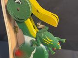 a wooden rocking duck with a bird on it ' s back