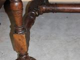 a wooden table with a wooden top and a wooden base