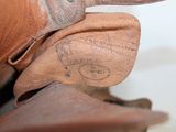 a close up of a pair of brown shoes