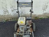 a small lawn mower that is sitting on the ground
