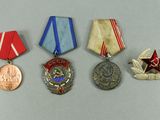 several medals and medals are displayed on a white surface