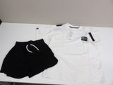a white shirt and black shorts sitting on a table