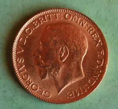 an image of a penny on a table with a green background