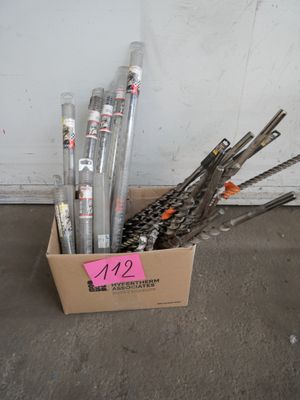 a cardboard box with a bunch of scissors in it