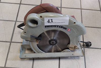 a picture of a circular saw on a tile floor