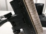 a close up of a black object on a white table