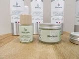 many different types of skin care products sitting on a table