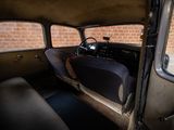 an old car that is sitting in the back of a building