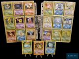a lot of pokemon cards that are on a table