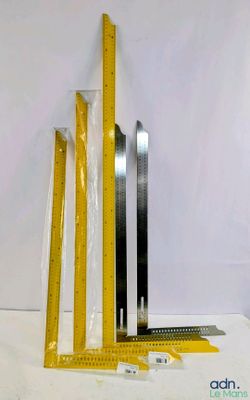 three rulers and a ruler sitting on a table