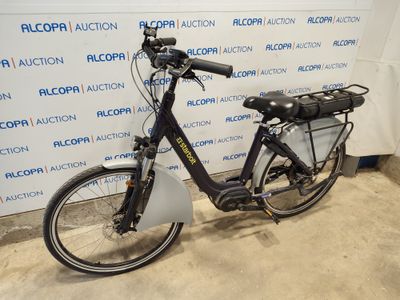 a bicycle that is parked in front of a wall