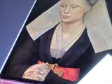 un tableau représentant une femme portant un voile sur la tête
