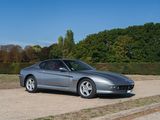 a silver sports car parked on the side of the road