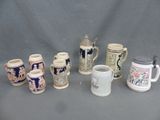 many different types of beer mugs lined up on a table