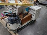 a pile of construction materials on a pallet in a warehouse