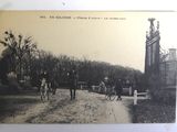 a black and white photo of a group of people riding horses