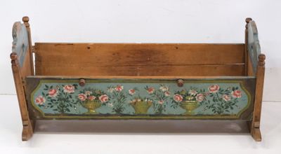 an old wooden magazine rack with flowers painted on it