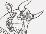 a drawing of a cow wearing a headdress on a white sheet