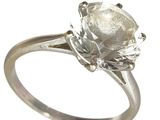 une image d'une bague en diamant sur fond blanc