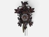 an image of a cuckoo clock with a bird on it ' s face