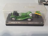 two model cars that are sitting in a display case