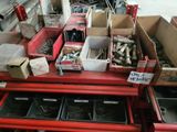 many boxes of assorted items on a red table