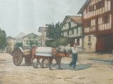 a painting of two horses pulling a cart down the street