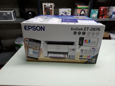 a box that is sitting on a table with a printer