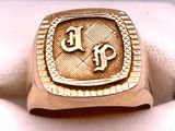 an image of a gold ring with the initials p and p on it