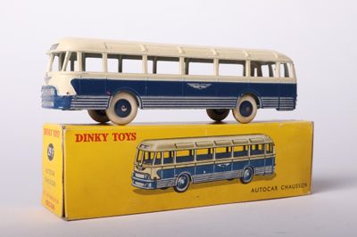 a toy bus that is sitting on top of a box