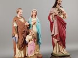 two figurines of jesus and mary with a child