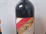 three bottles of wine sitting next to each other on a table