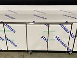 a group of four freezers sitting on top of a counter