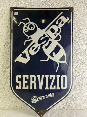 blue and white sign on a wall that says service with a picture of a man holding a wren