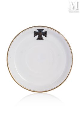 a white plate with a black cross on it