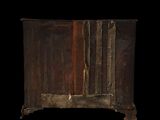 an old wooden cabinet with a door on the front