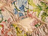 a close up of a piece of cloth with flowers on it
