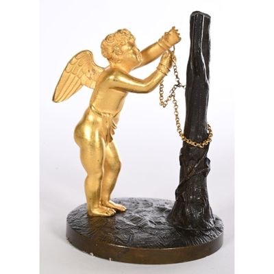 an image of a statue of an angel with a chain around his neck