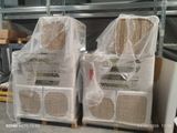two stacks of boxes are wrapped in plastic and stacked on top of each other