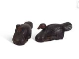 pair of wooden ducks on a white background with a white background