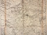 an old map of the city of london, with a river running through it