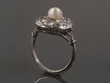 a white pearl and diamond ring