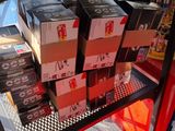 many boxes of beer on a shelf in a store