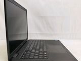 the laptop is sitting on a white surface with a black keyboard